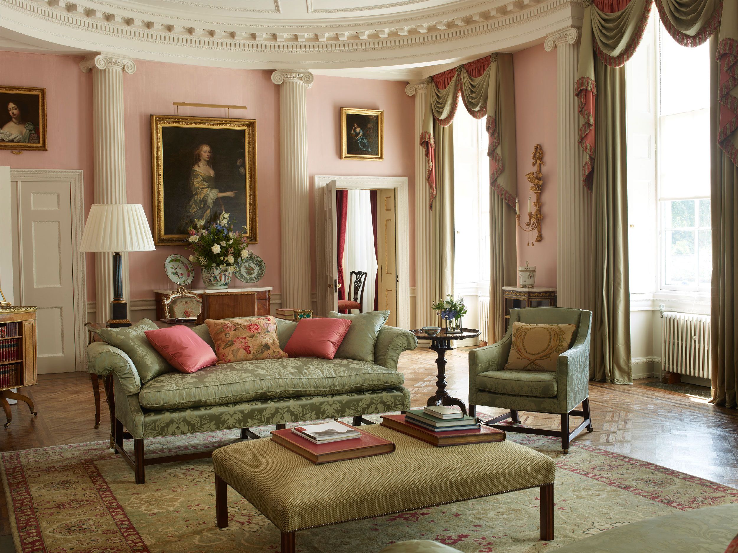 Image may contain: Home Decor, Art, Painting, Lamp, Rug, Couch, Furniture, Chair, Architecture, Building, and Indoors