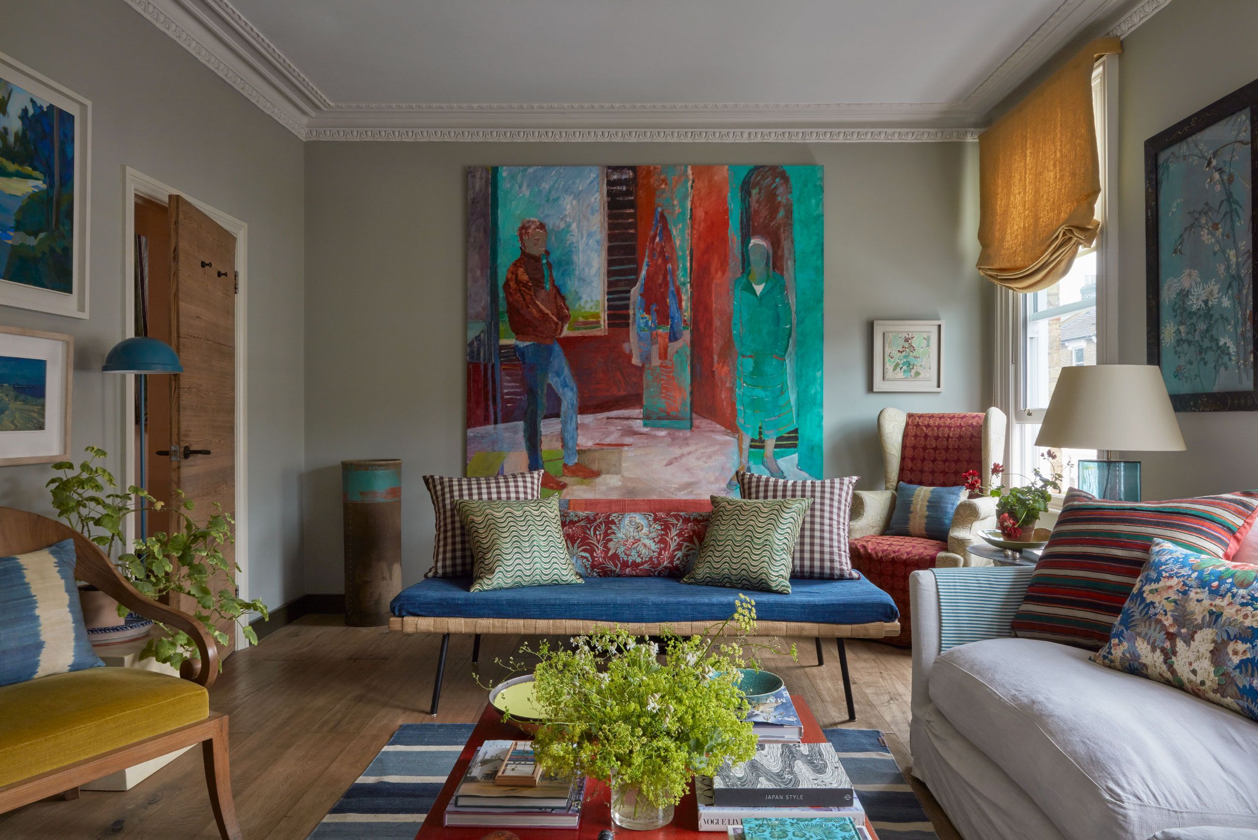 Image may contain: Home Decor, Architecture, Building, Furniture, Indoors, Living Room, Room, Couch, Cushion, Chair, and Lamp