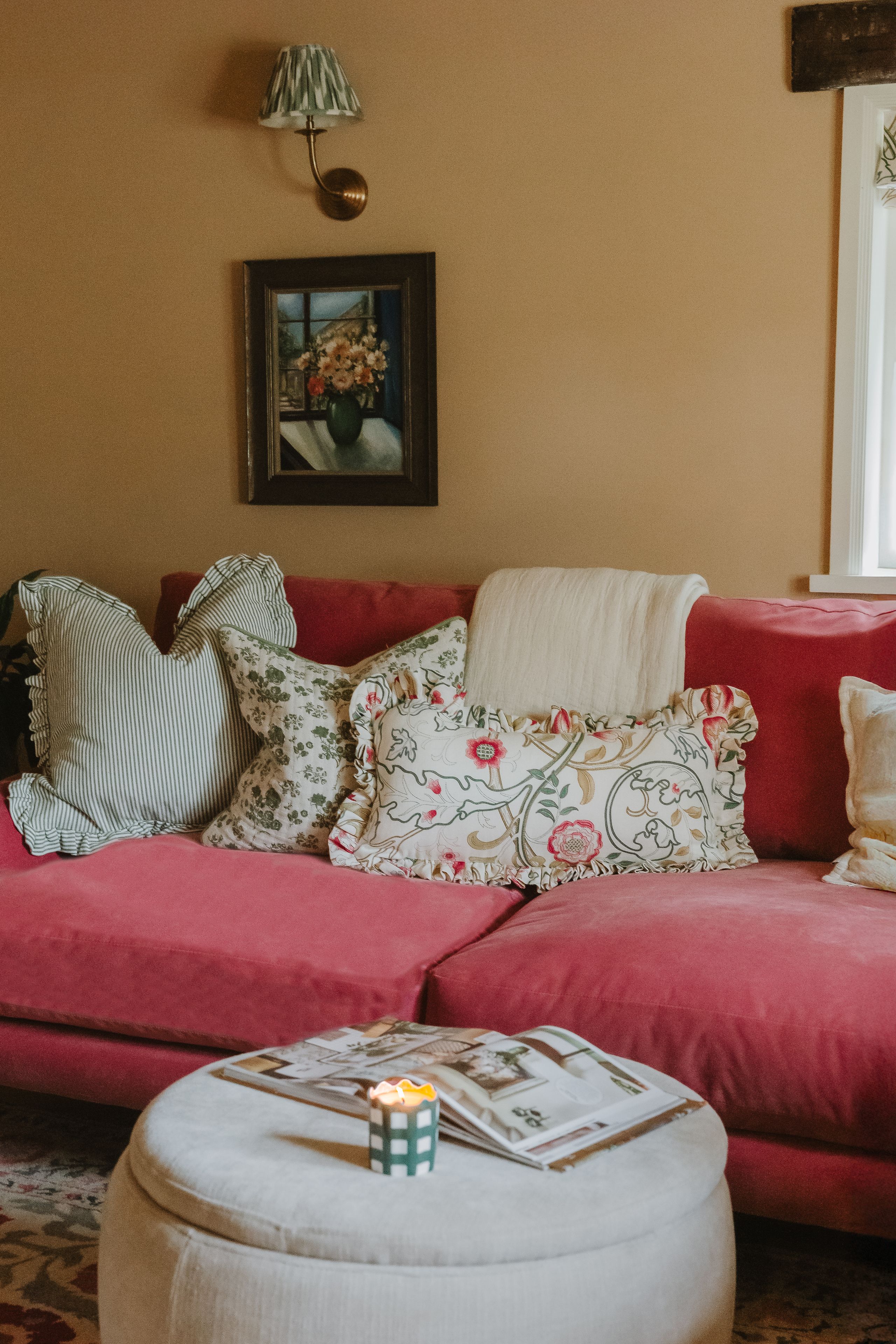 Image may contain: Lamp, Cushion, Home Decor, Couch, Furniture, Architecture, Building, Indoors, Living Room, Room, and Art