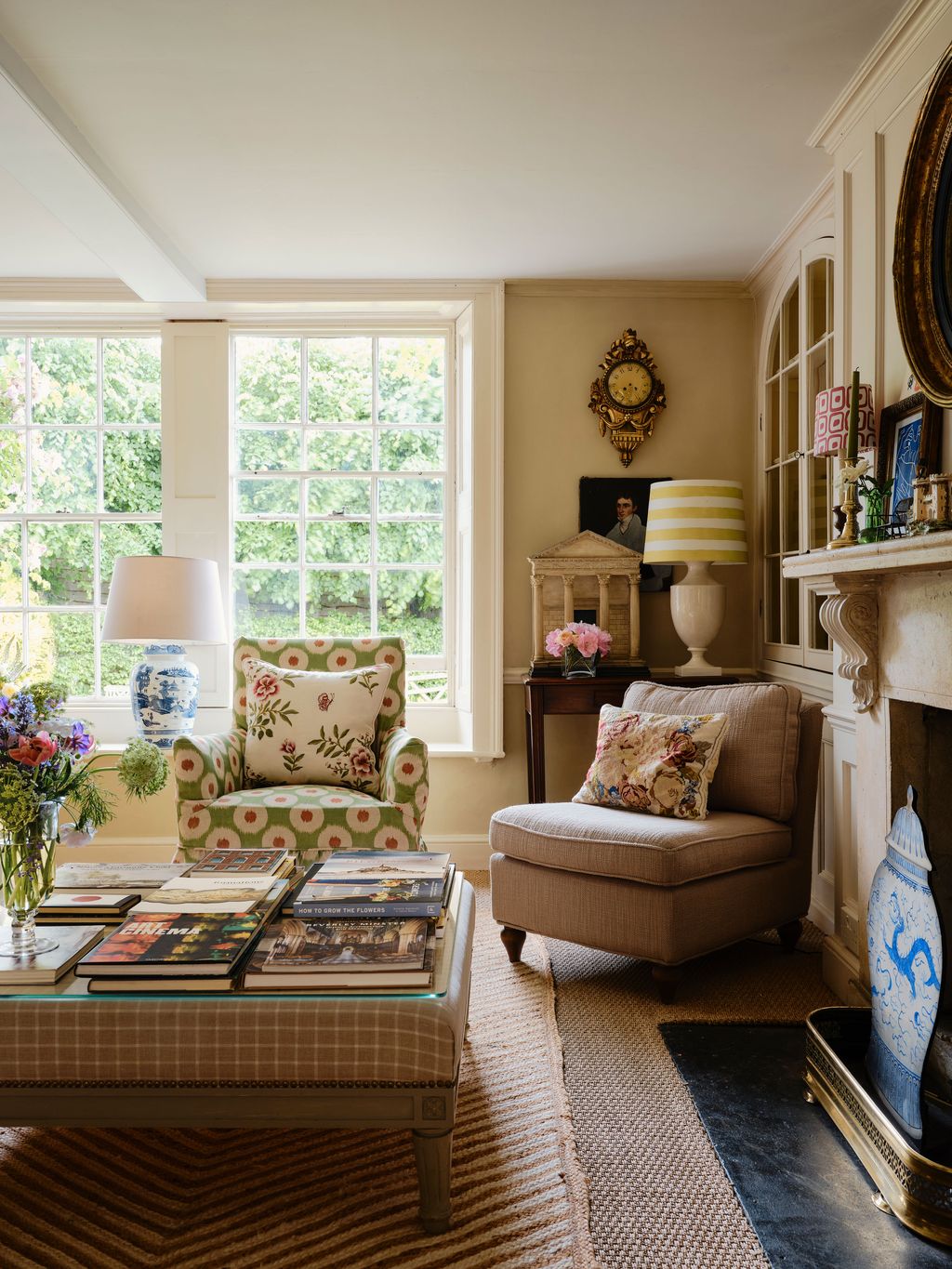 Image may contain Lamp Home Decor Desk Furniture Table Person Rug Chair Cushion Art Painting and Window