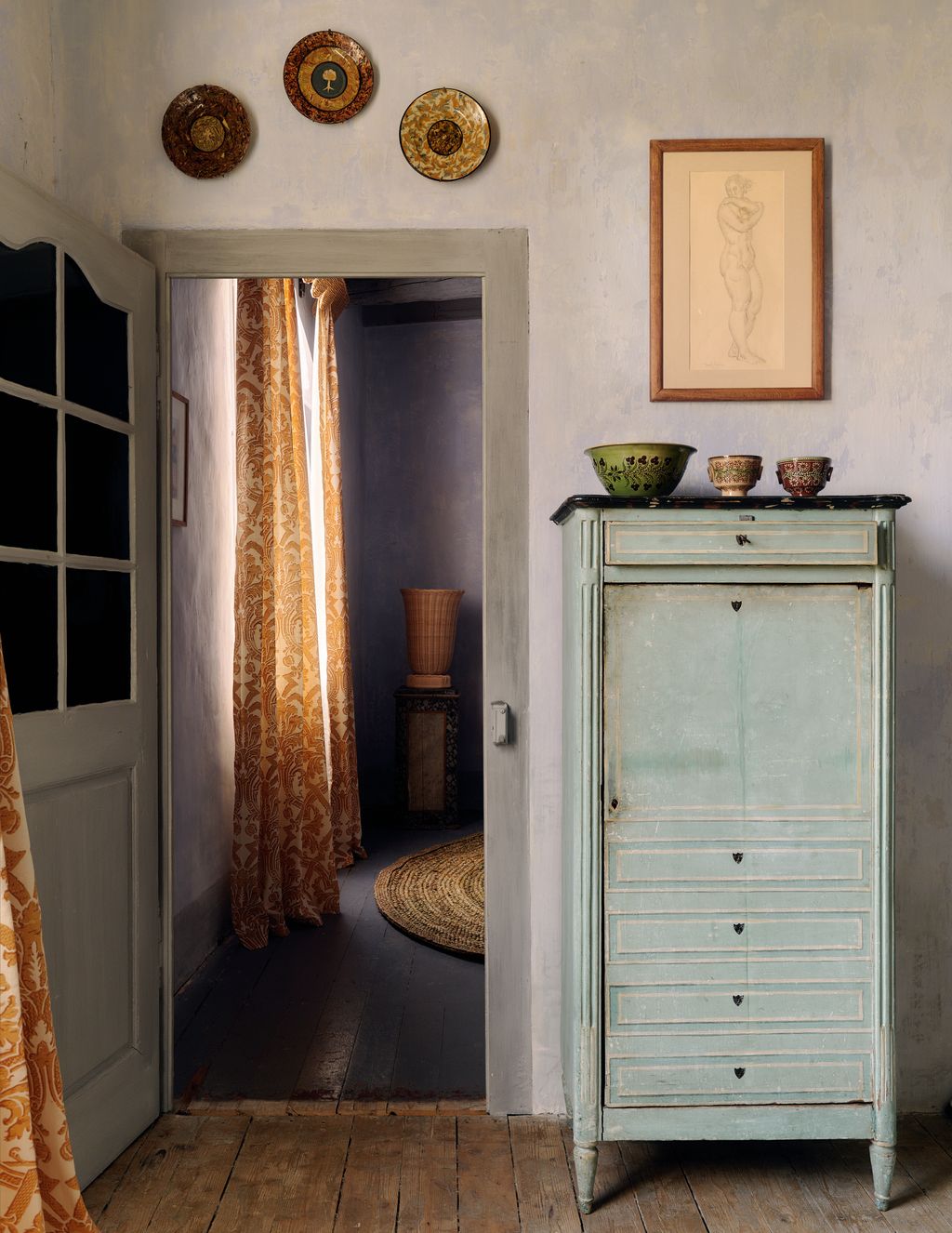 Image may contain Corner Art Painting Home Decor Rug Indoors Interior Design Furniture Closet Cupboard and Plate