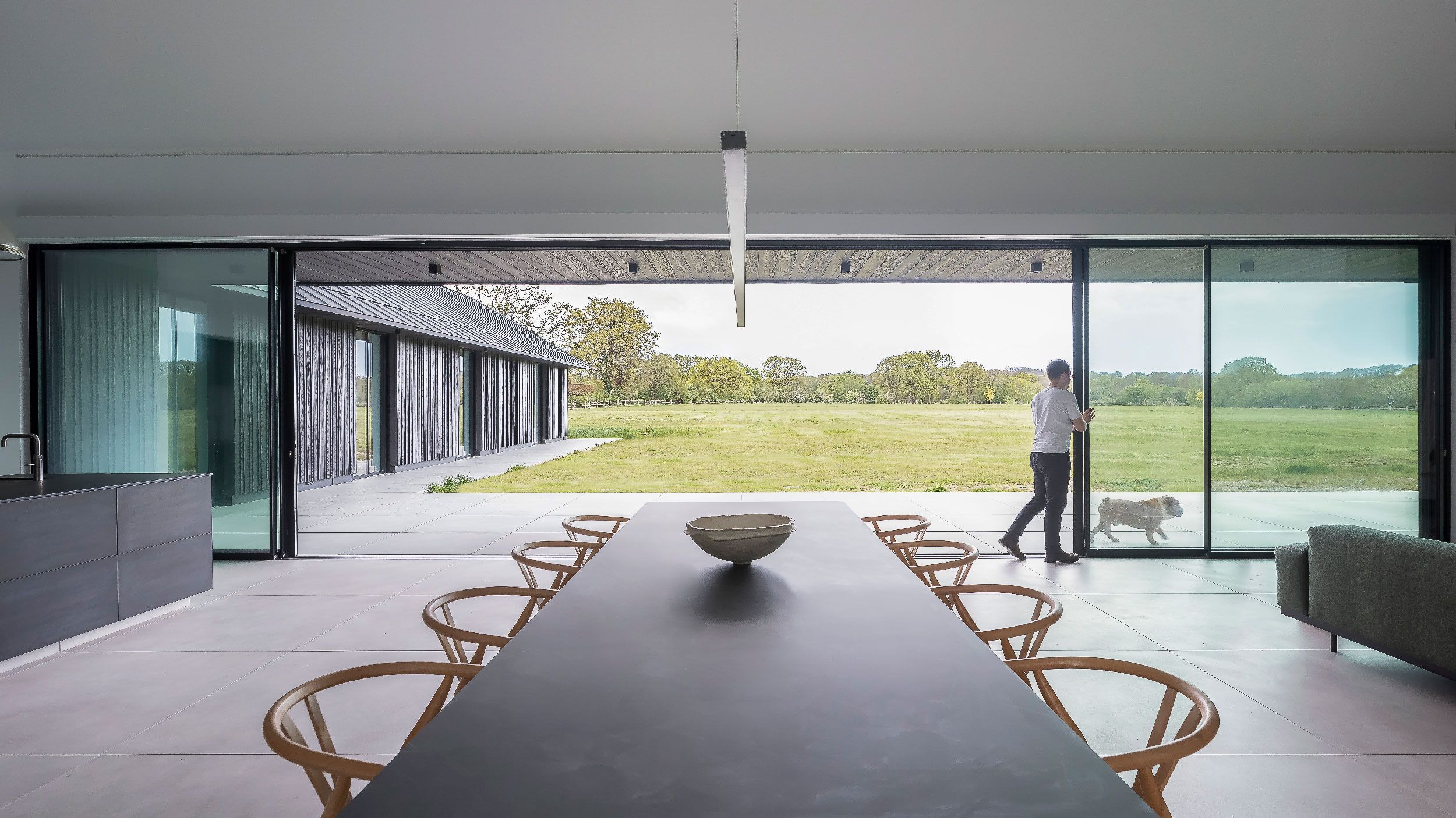 Image may contain: Indoors, Interior Design, Person, Architecture, Building, Dining Room, Dining Table, Furniture, and Room