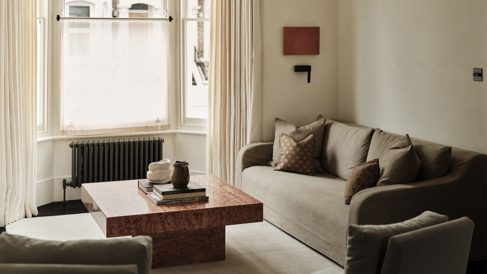 Image may contain: Coffee Table, Furniture, Table, Couch, Architecture, Building, Indoors, Living Room, Room, and Home Decor