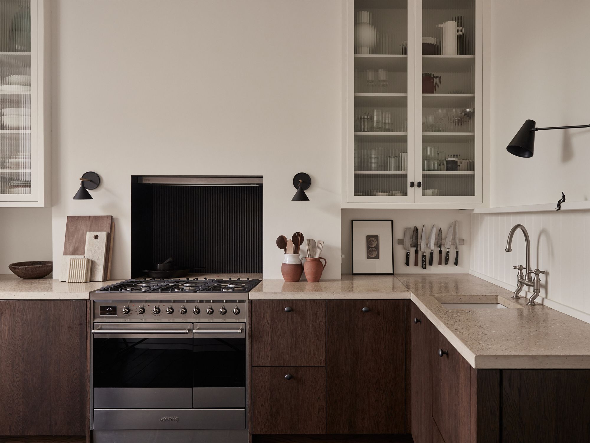 Image may contain: Indoors, Interior Design, Kitchen, Lamp, Cooktop, Sink, and Sink Faucet