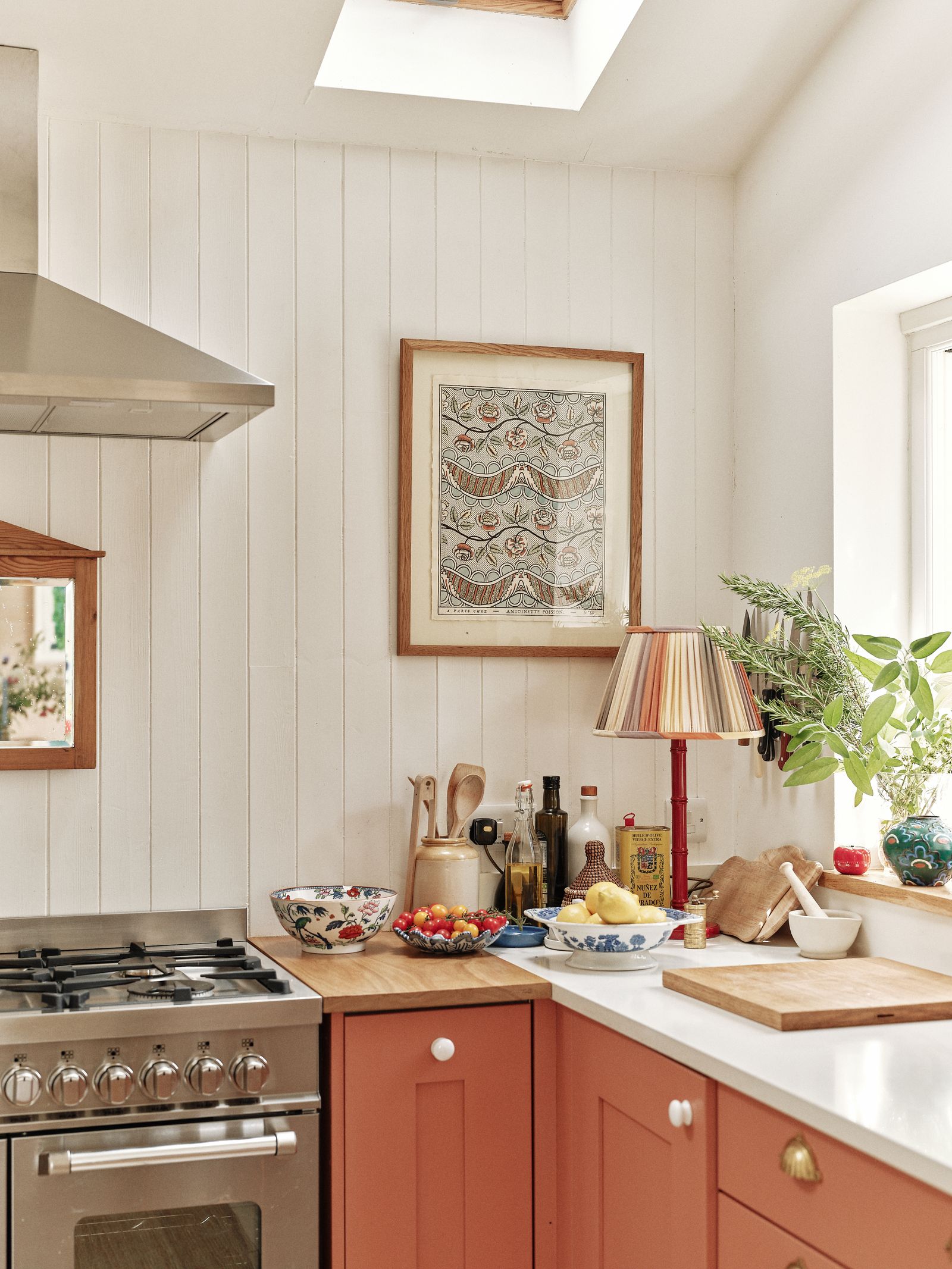 Image may contain Indoors Interior Design Lamp Art Painting Kitchen Cooktop Plant Accessories Bag and Handbag