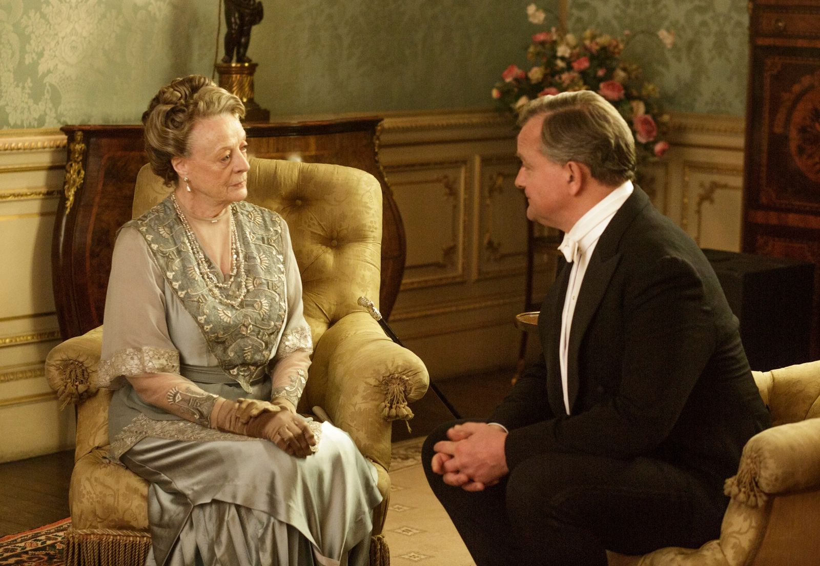 Image may contain Maggie Smith Hugh Bonneville Person Clothing Glove Adult Wedding Couch Furniture and Accessories