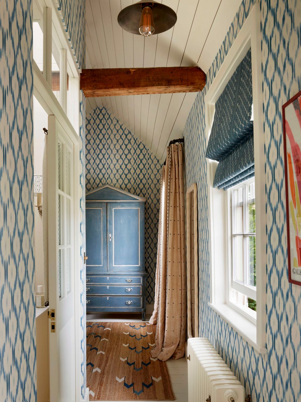 Image may contain Indoors Interior Design Candle Architecture Building Foyer Home Decor and Rug