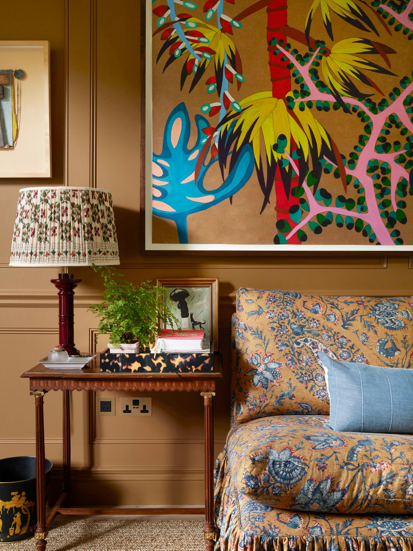 Image may contain Lamp Home Decor Indoors Interior Design Plant Art Painting Cushion Couch and Furniture