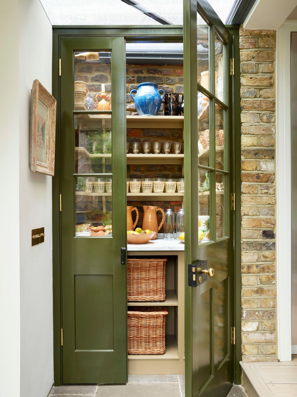 Image may contain Shelf Door Pantry Art Painting Architecture Building Housing Indoors and Interior Design