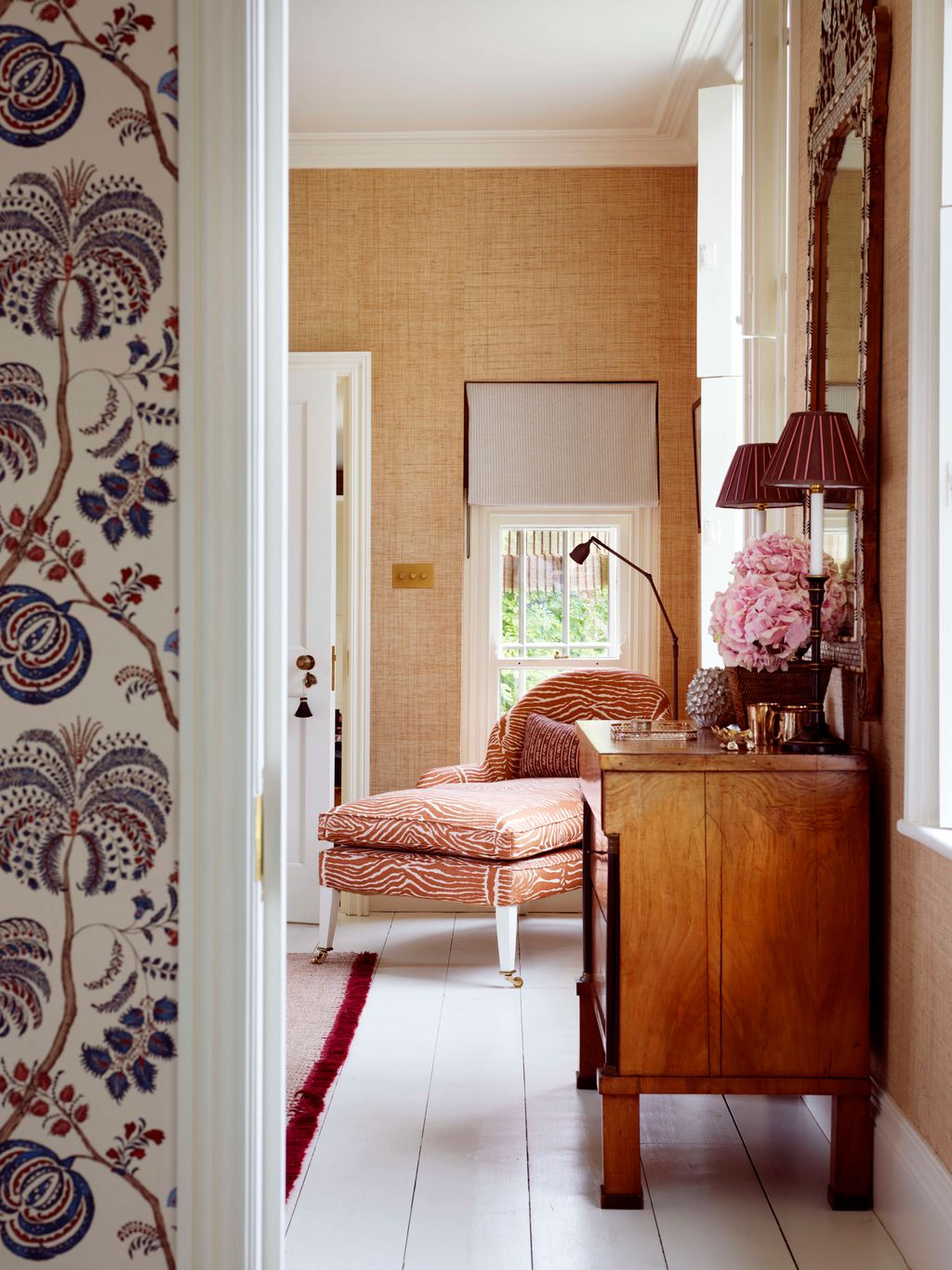 Image may contain Indoors Interior Design Home Decor Lamp Chair Furniture and Rug