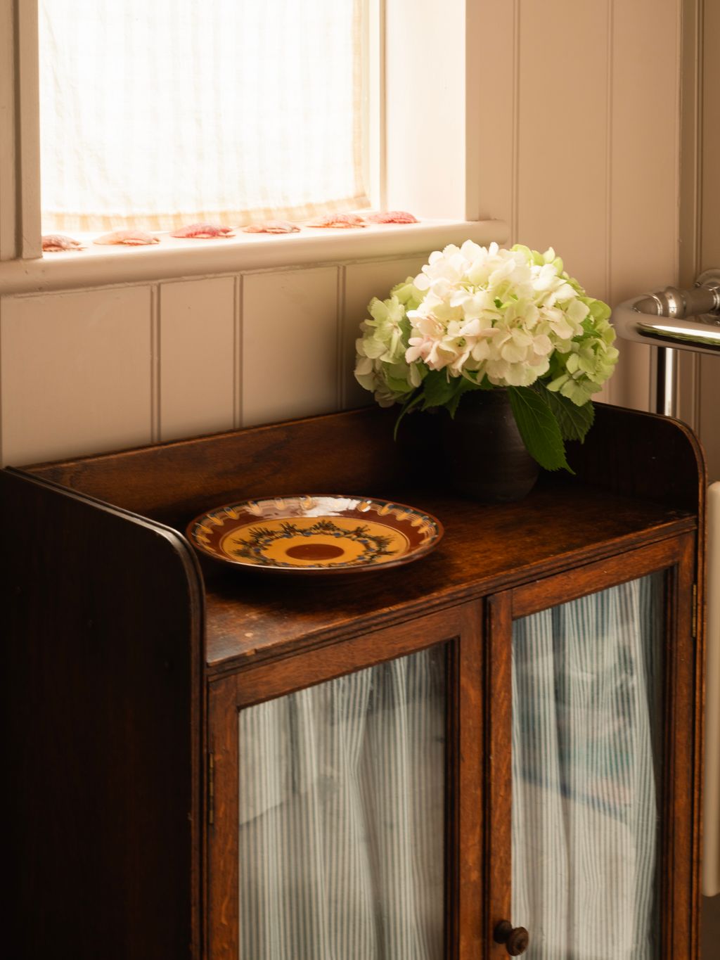 Image may contain Plate Hardwood Wood Furniture Flower Plant Flower Arrangement Flower Bouquet and Sideboard