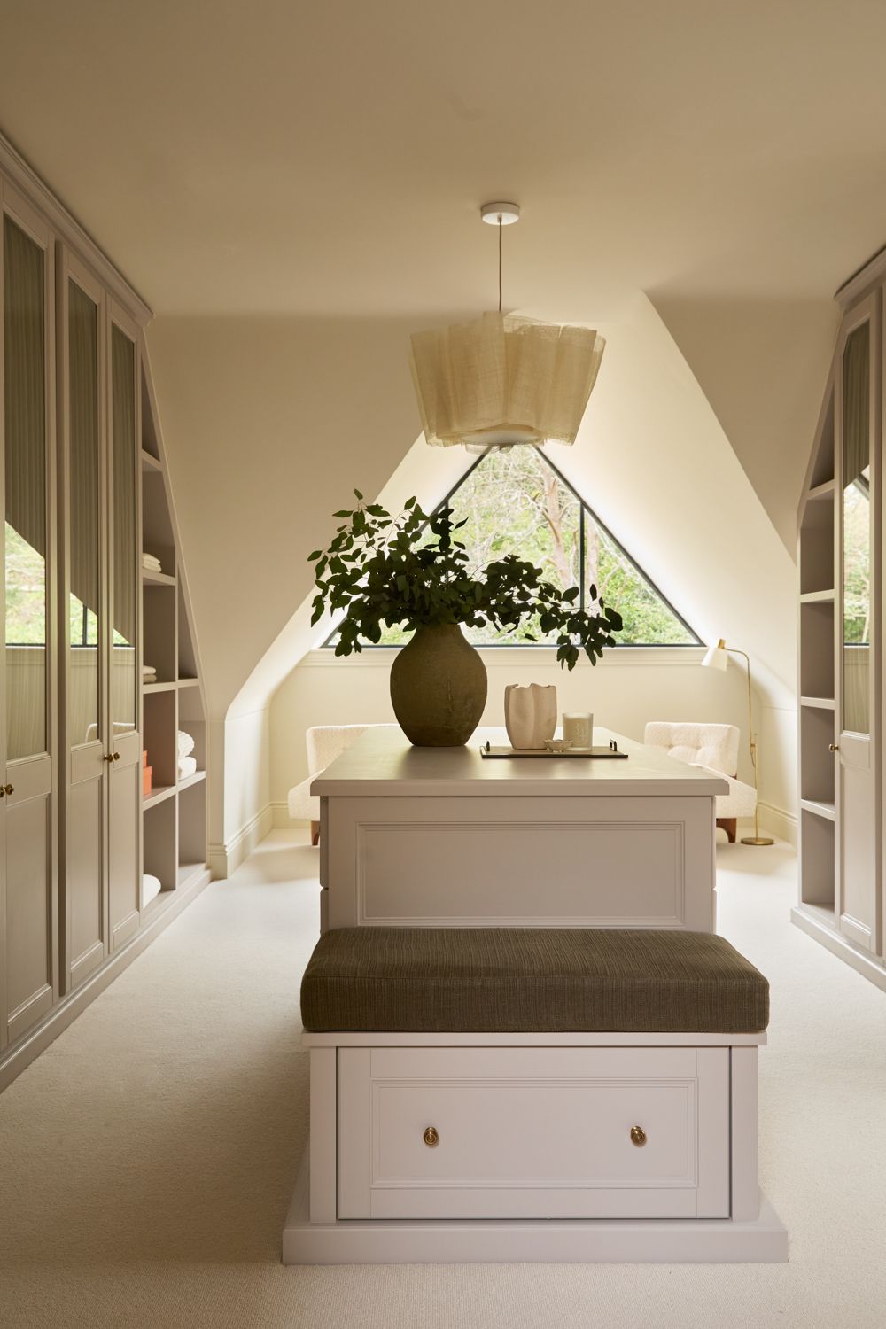 Image may contain: Lamp, Plant, Cup, Indoors, Interior Design, Architecture, Building, Furniture, Living Room, and Room