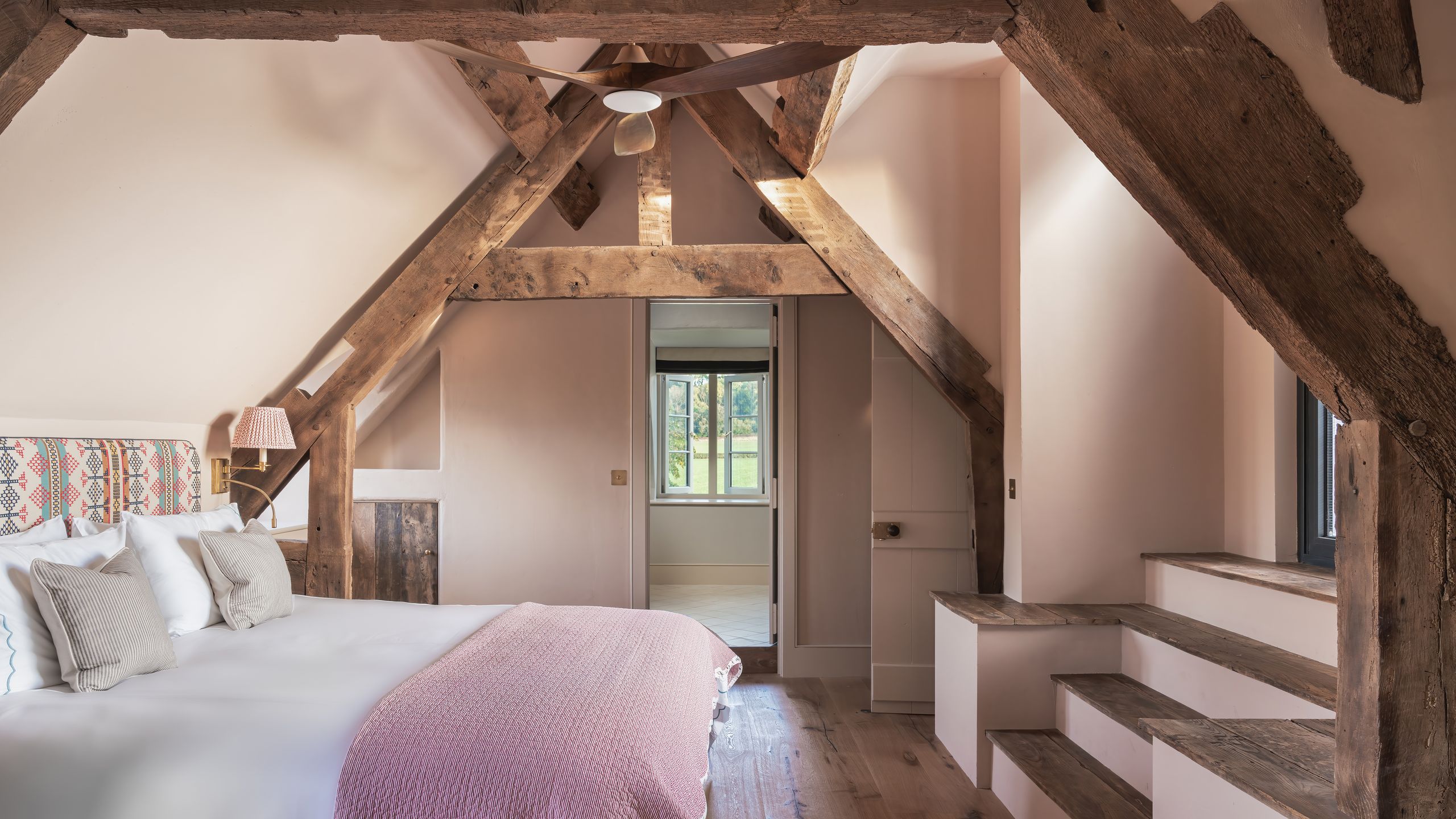 Image may contain: Indoors, Interior Design, Architecture, Building, House, Housing, Loft, Room, Bed, Furniture, and Wood