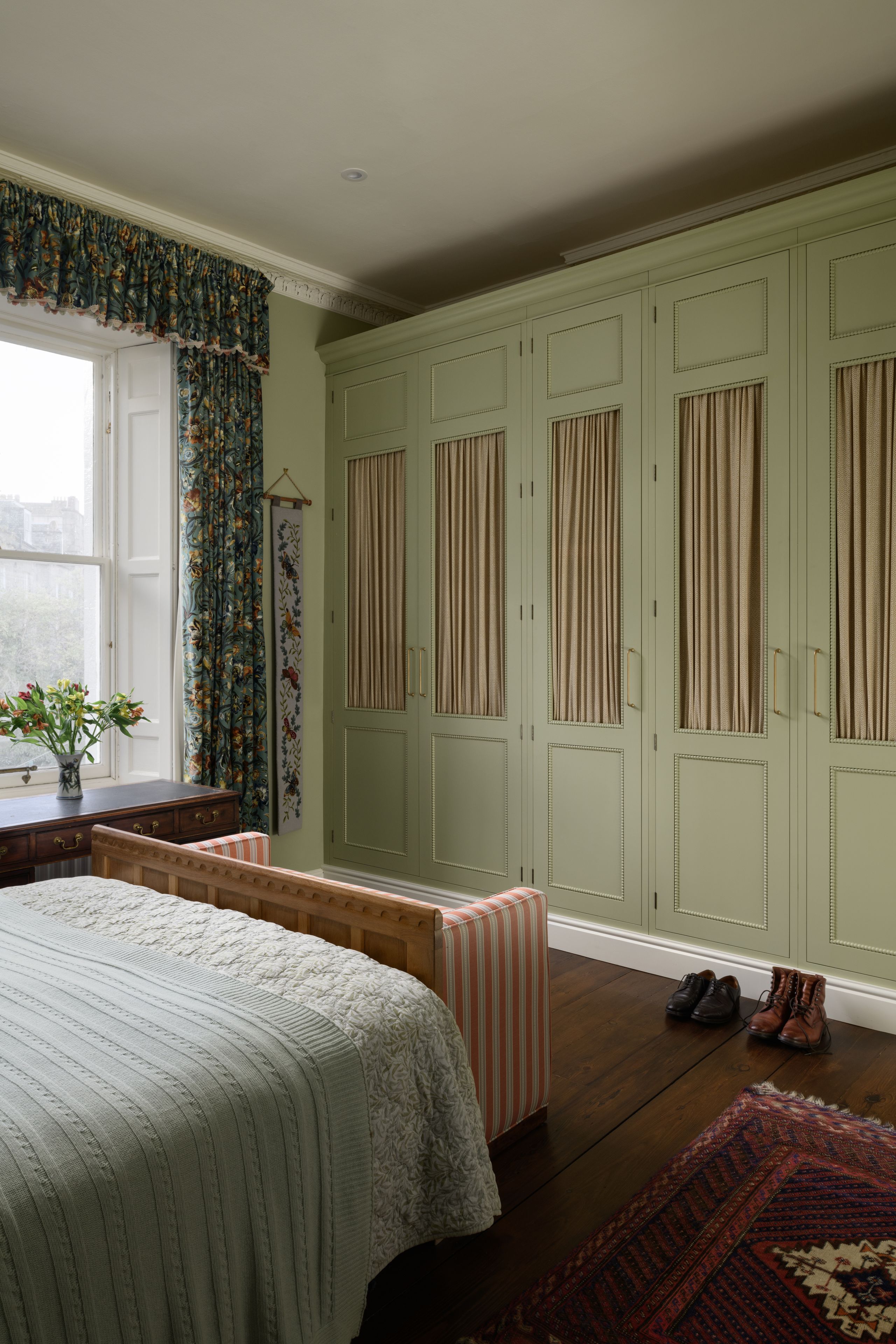 Image may contain: Indoors, Interior Design, Home Decor, Rug, Bed, Furniture, Clothing, Footwear, Shoe, Corner, and Bedroom