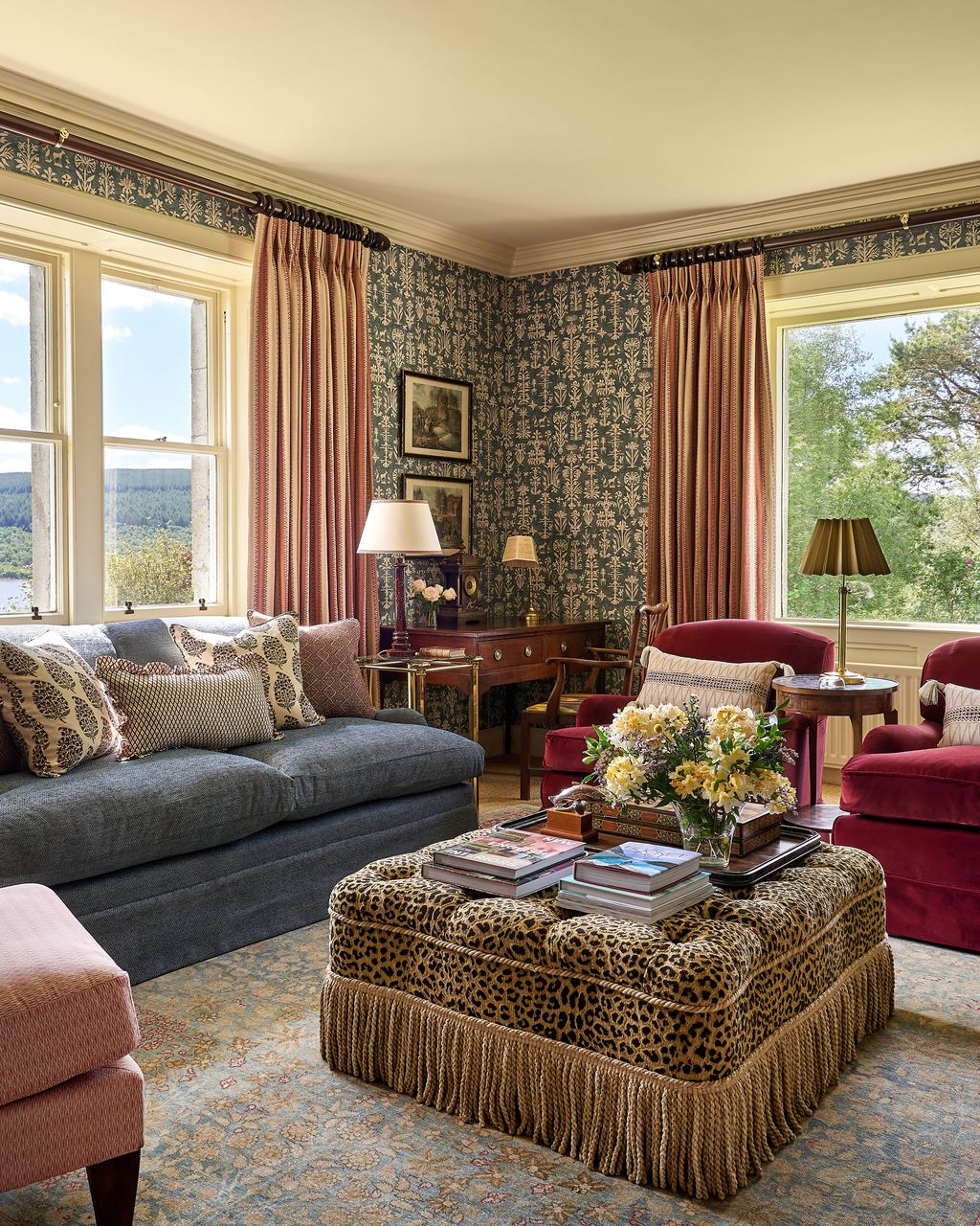 Image may contain Lamp Couch Furniture Art Painting Chair Home Decor Rug Desk and Table