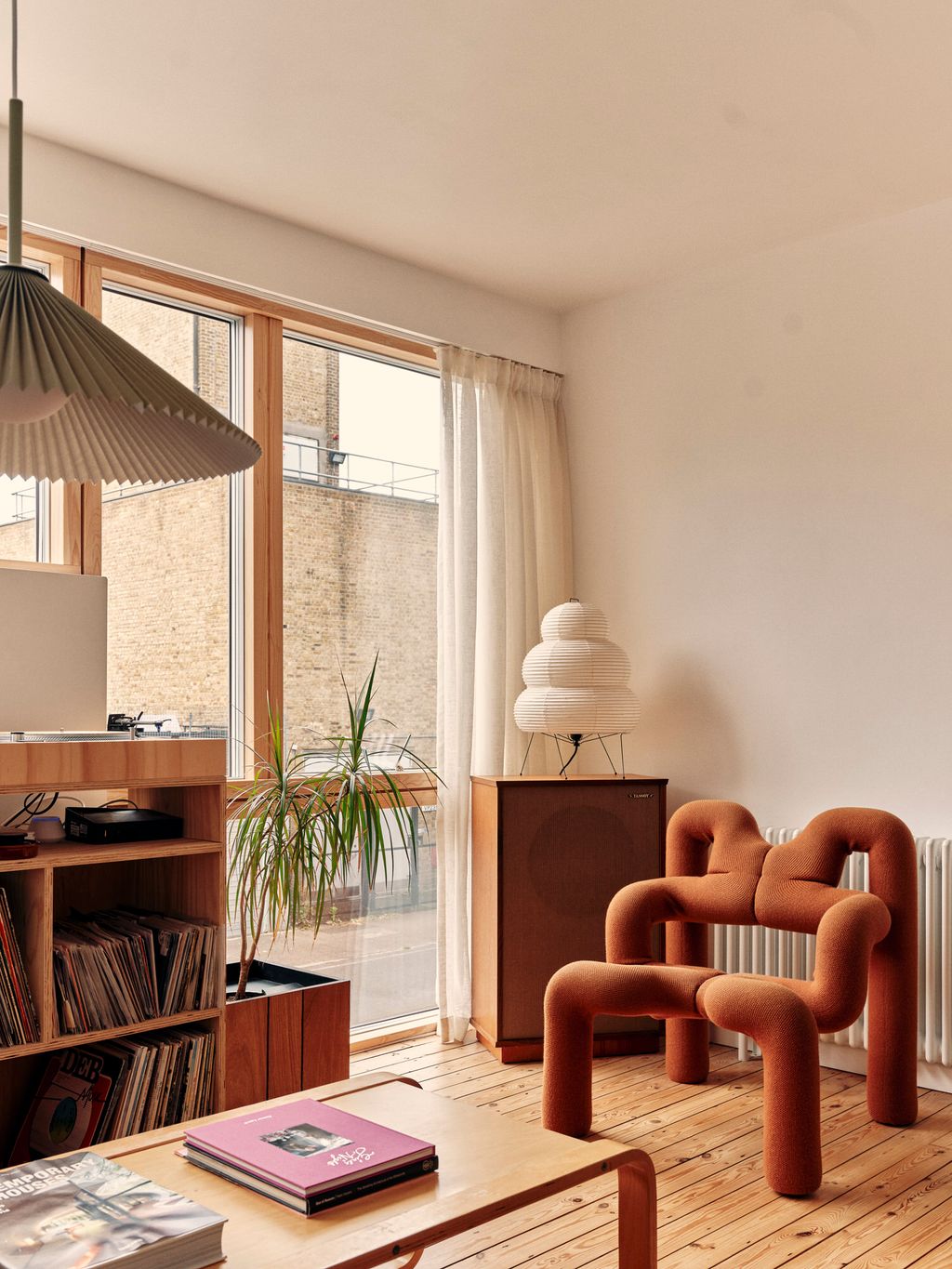 Image may contain Plant Indoors Interior Design Chair Furniture Desk Table Lamp Architecture and Building