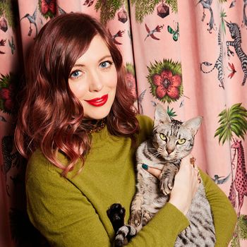 Image may contain: Michelle Morgan, Face, Head, Person, Photography, Portrait, Adult, Animal, Cat, Mammal, and Pet