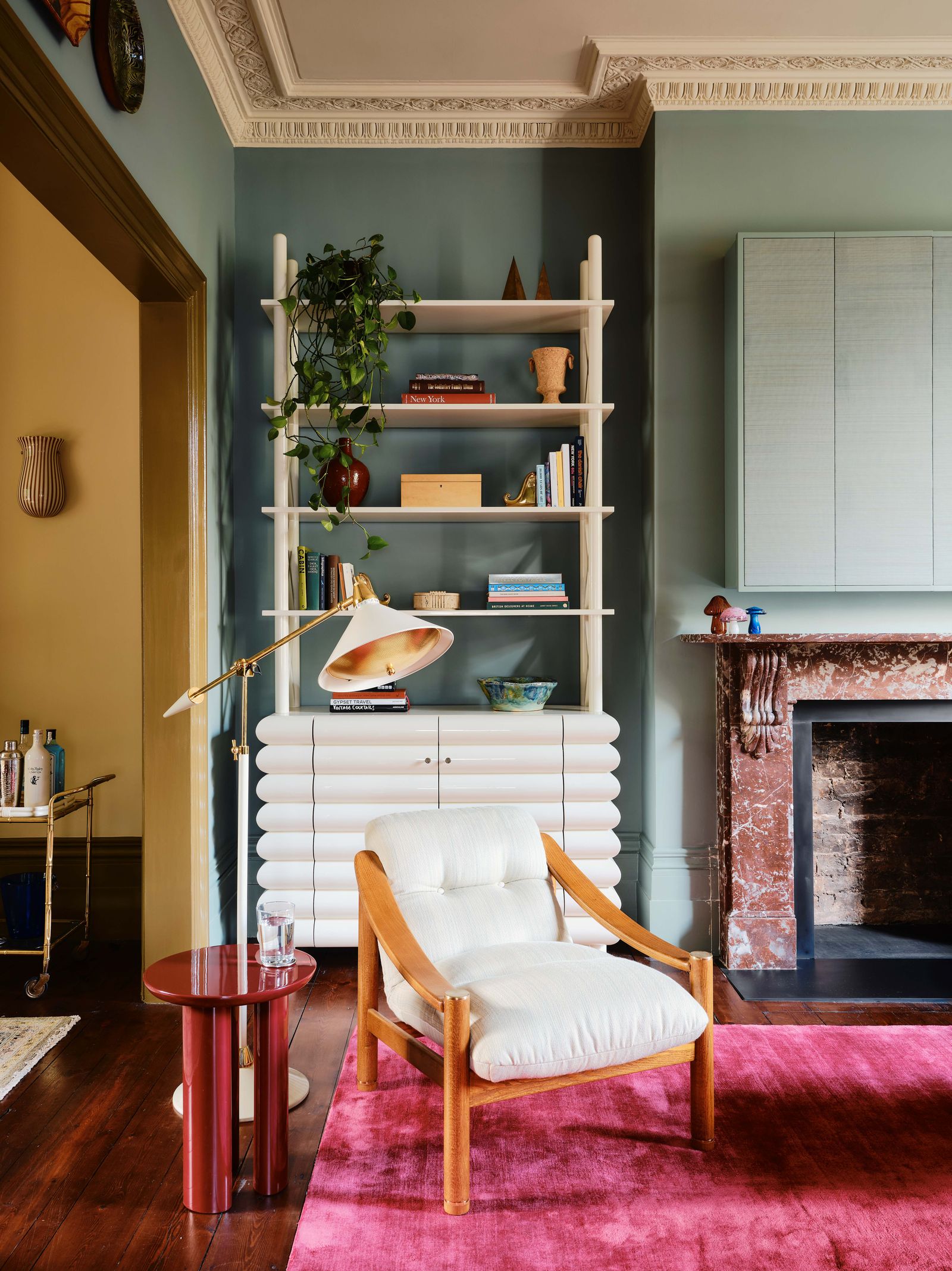 Image may contain Chair Furniture Home Decor Box Rug Plant Cup Indoors Interior Design Candle Bookcase and Desk