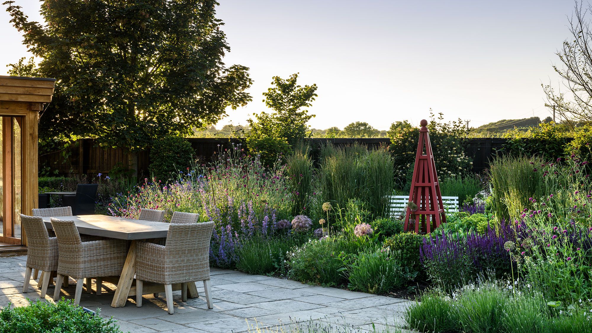 Image may contain: Backyard, Nature, Outdoors, Yard, Garden, Grass, Plant, Indoors, Interior Design, Chair, and Furniture