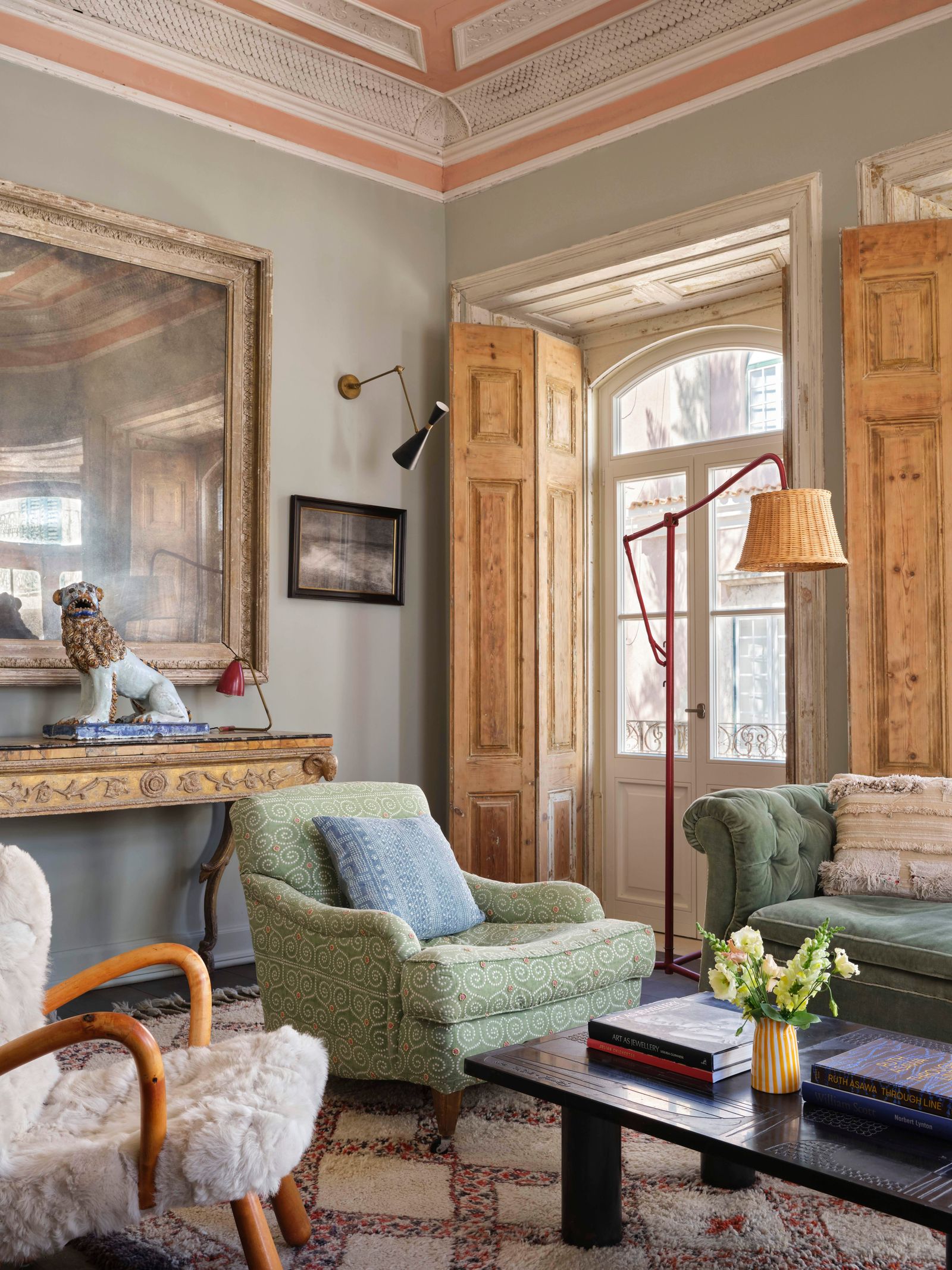 Image may contain Indoors Interior Design Home Decor Lamp Architecture Building Furniture Living Room Room and Desk