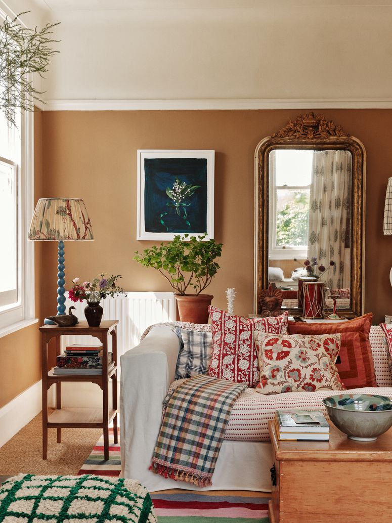 Image may contain: Home Decor, Cushion, Plant, Lamp, Couch, Furniture, Architecture, Building, Indoors, Living Room, and Room