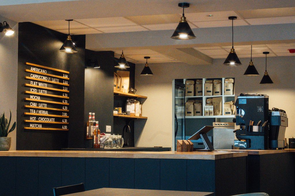 Image may contain Lamp Plant Indoors Shop Chair Furniture Cafe Restaurant Market Grocery Store and Supermarket