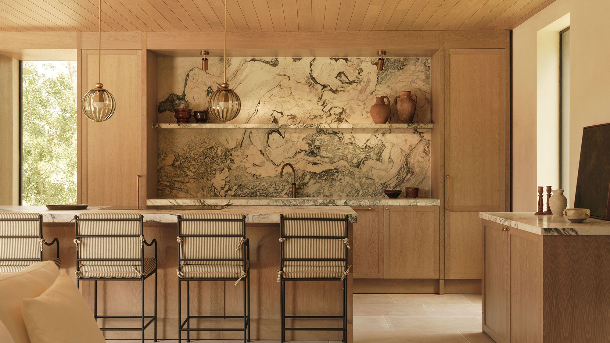 Image may contain: Indoors, Interior Design, Chair, Furniture, Lamp, Sink, Sink Faucet, Kitchen, and Cup