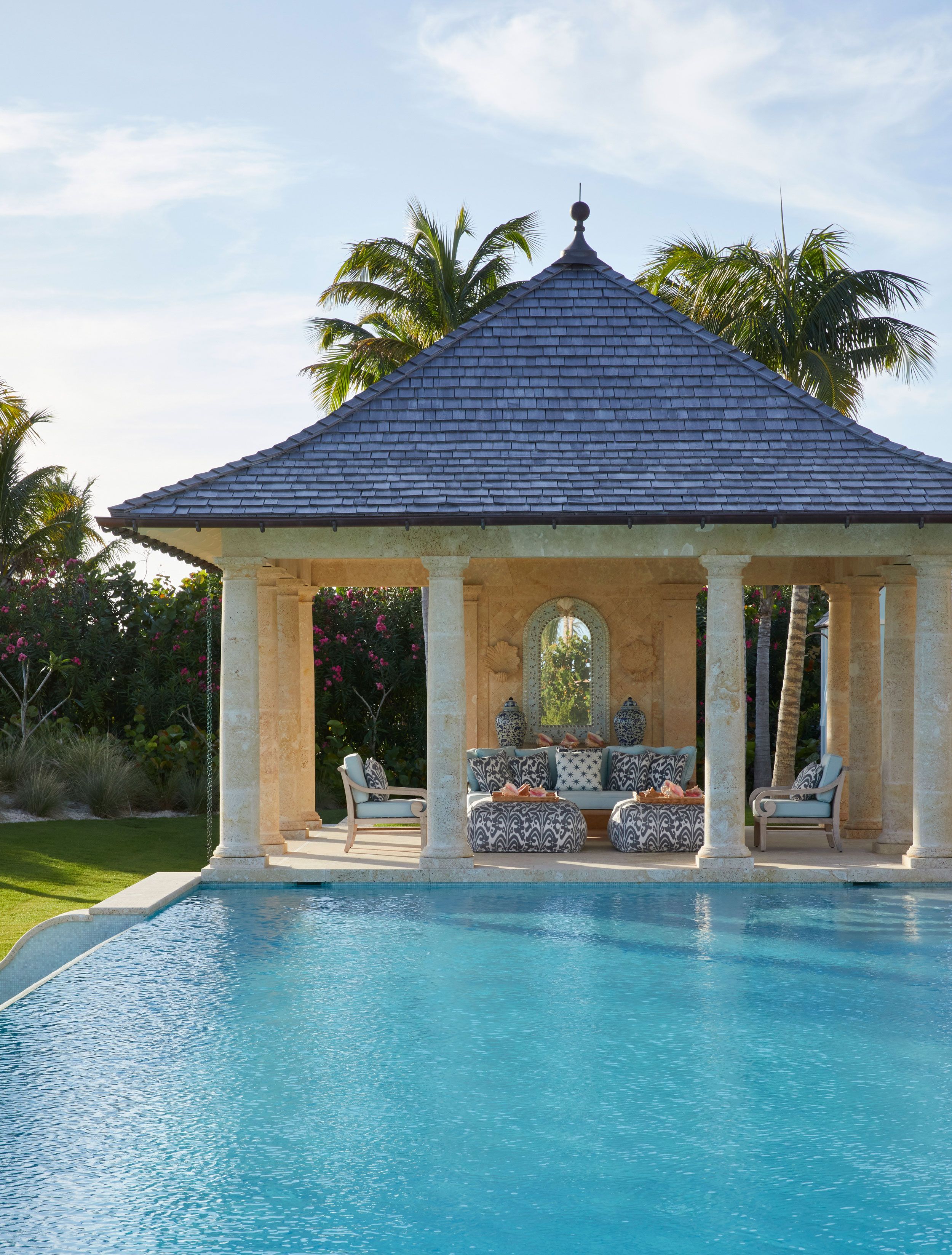 Image may contain: Chair, Furniture, Outdoors, Pool, Water, Couch, and Swimming Pool