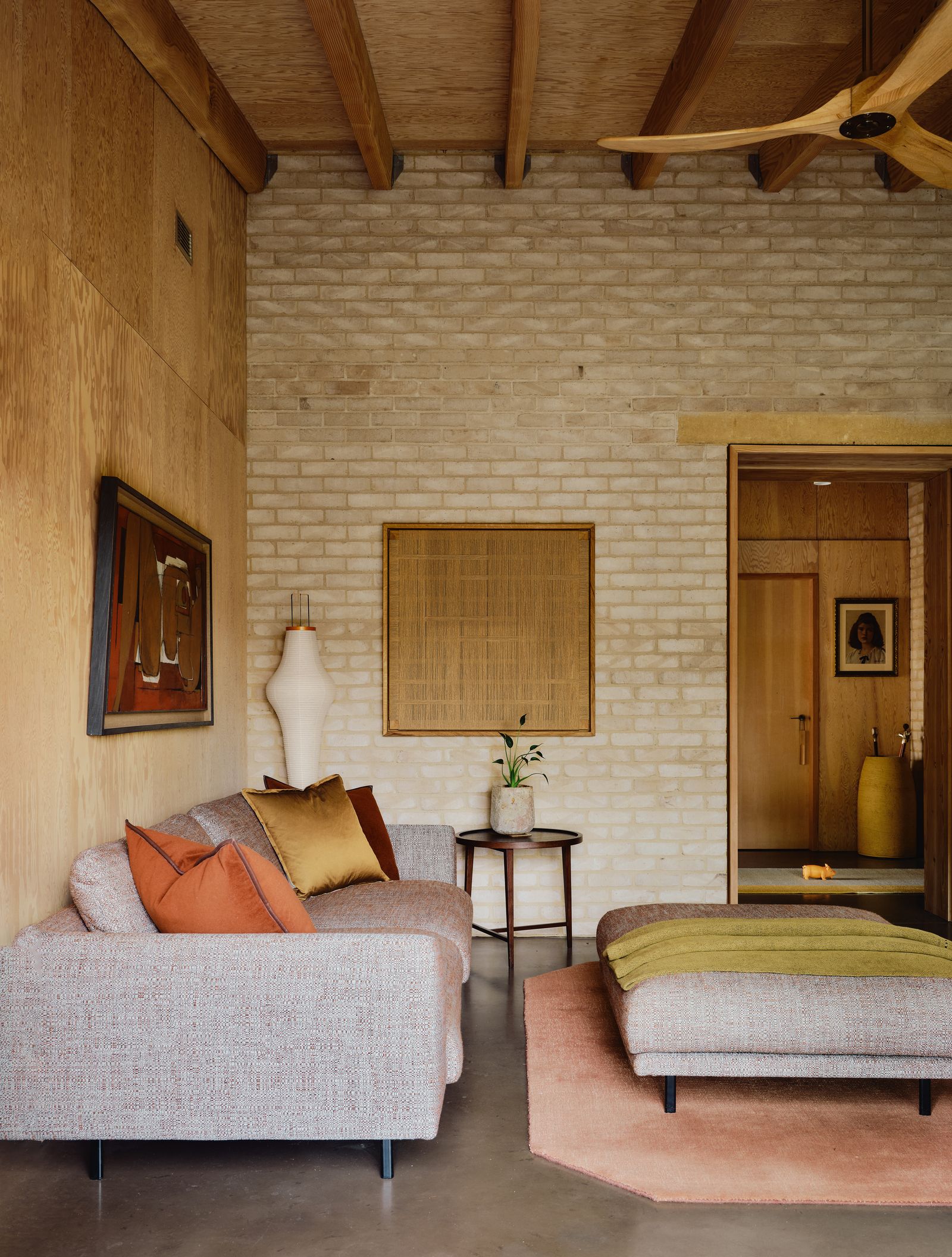 In the study a de Le Cuona throw and cushions and ampTraditions ‘The Moor rug enliven Arflexs ‘Bel Air sofa and pouf an...