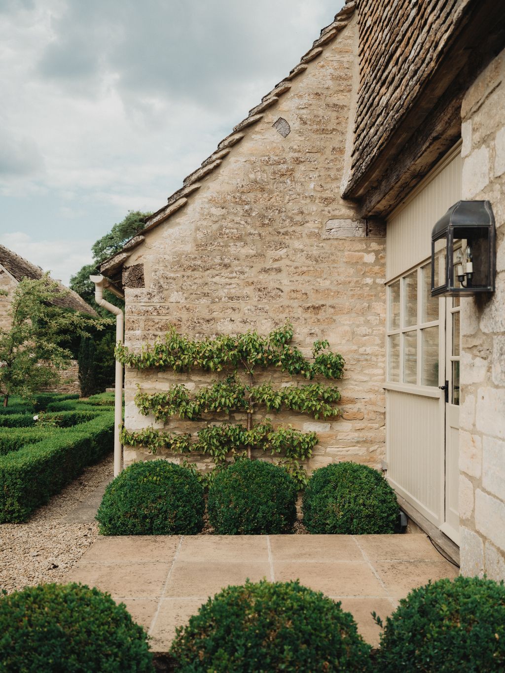A glimpse of the parterre garden outside the house. The lantern is by The Limehouse Lamp Company.