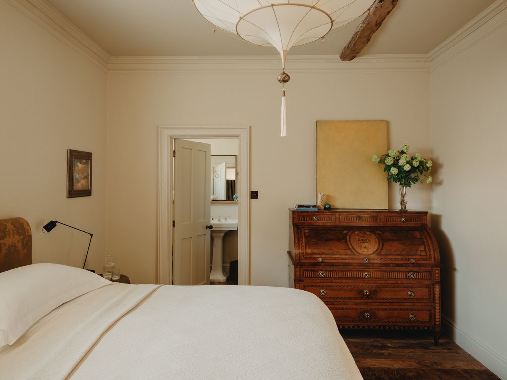 An 18thcentury Louis XVI cylinder secretaire was sourced at auction and restored. A ‘Meditation painting by J B Wiskey...