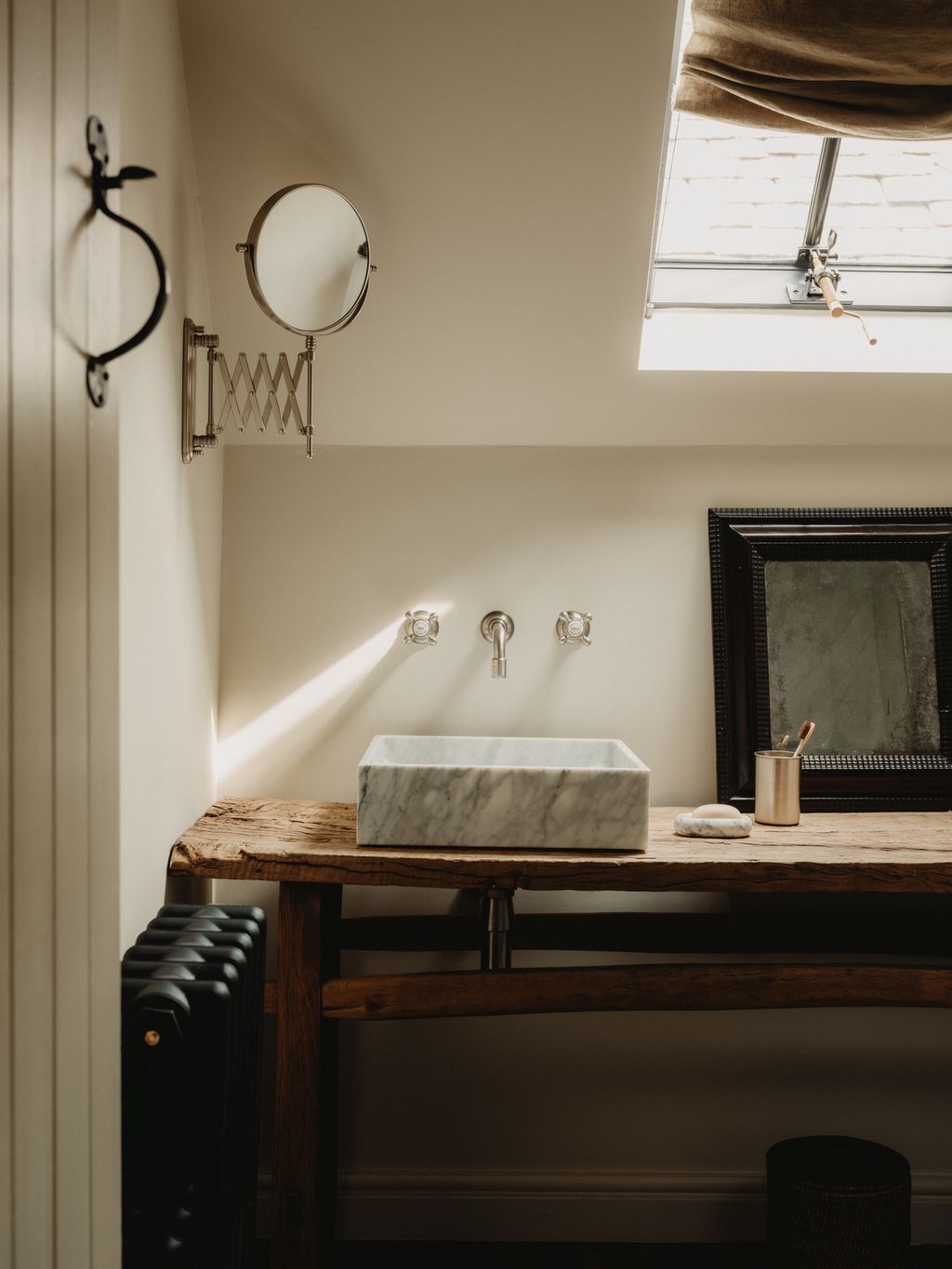 A tiny bathroom has been squeezed in under the eaves with the shower occupying the only full height corner. Laura and...