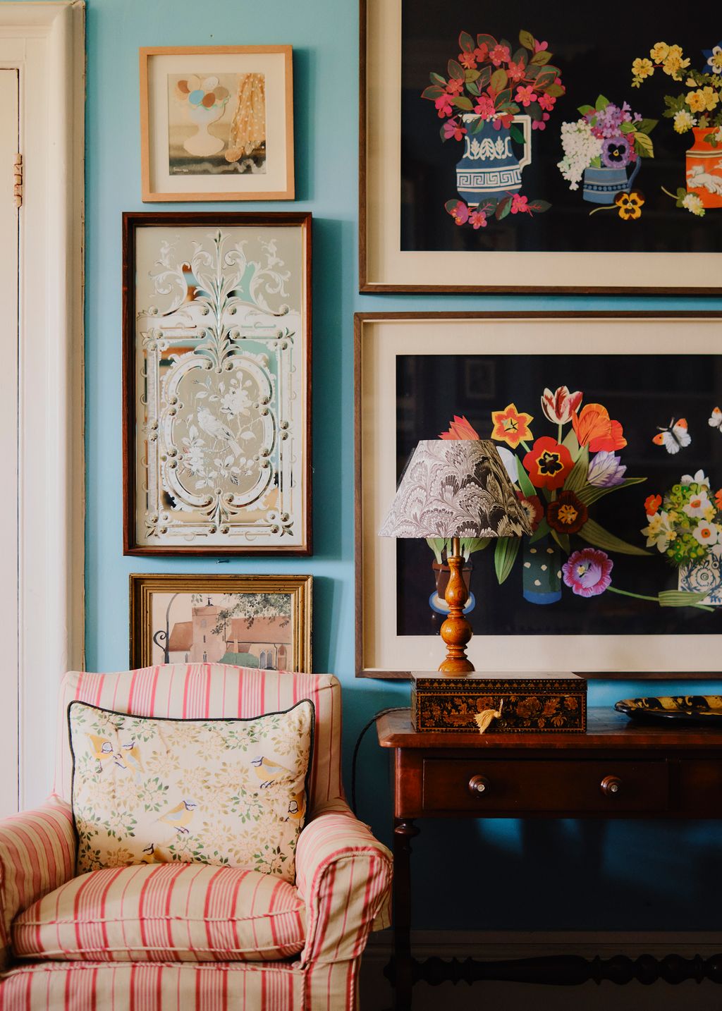 The living room walls are lined with cherished artworks among them still lifes by Matthews late mother Pat Albeck. ‘In...
