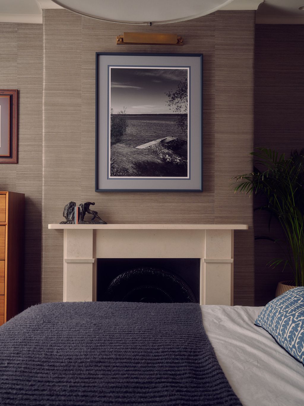 Above the fireplace hangs a photograph taken by the owner which Nicholas and Sophie had framed in a bespoke navy frame.