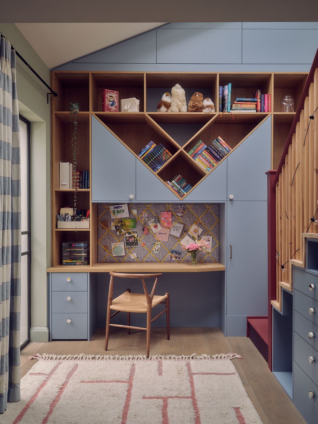In the daughter's bedroom bespoke joinery offers not just a workspace but plenty of places to tidy away mess. Hidden in...