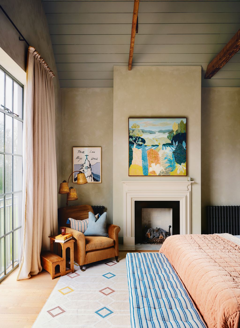 An assortment of vintage furniture and textiles a geometric rug from Vanderhurd and distinctive artworks by Tracey Emin...