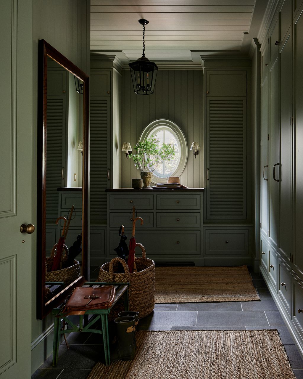 Painted in Farrow Ball's ‘French Grey and having a little less natural light the boot room has a hushed cocooning...