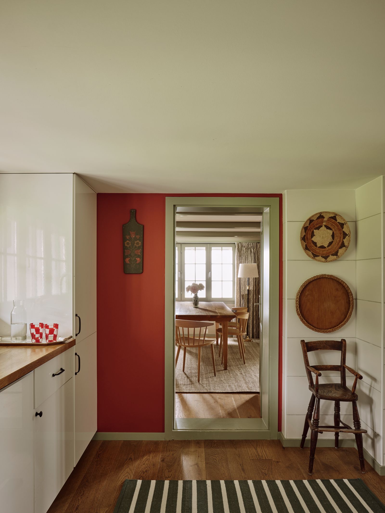 In the kitchen Deniz strayed from the pale colour palette and painted the walls in Farrow amp Balls ‘Eating Room Red to...
