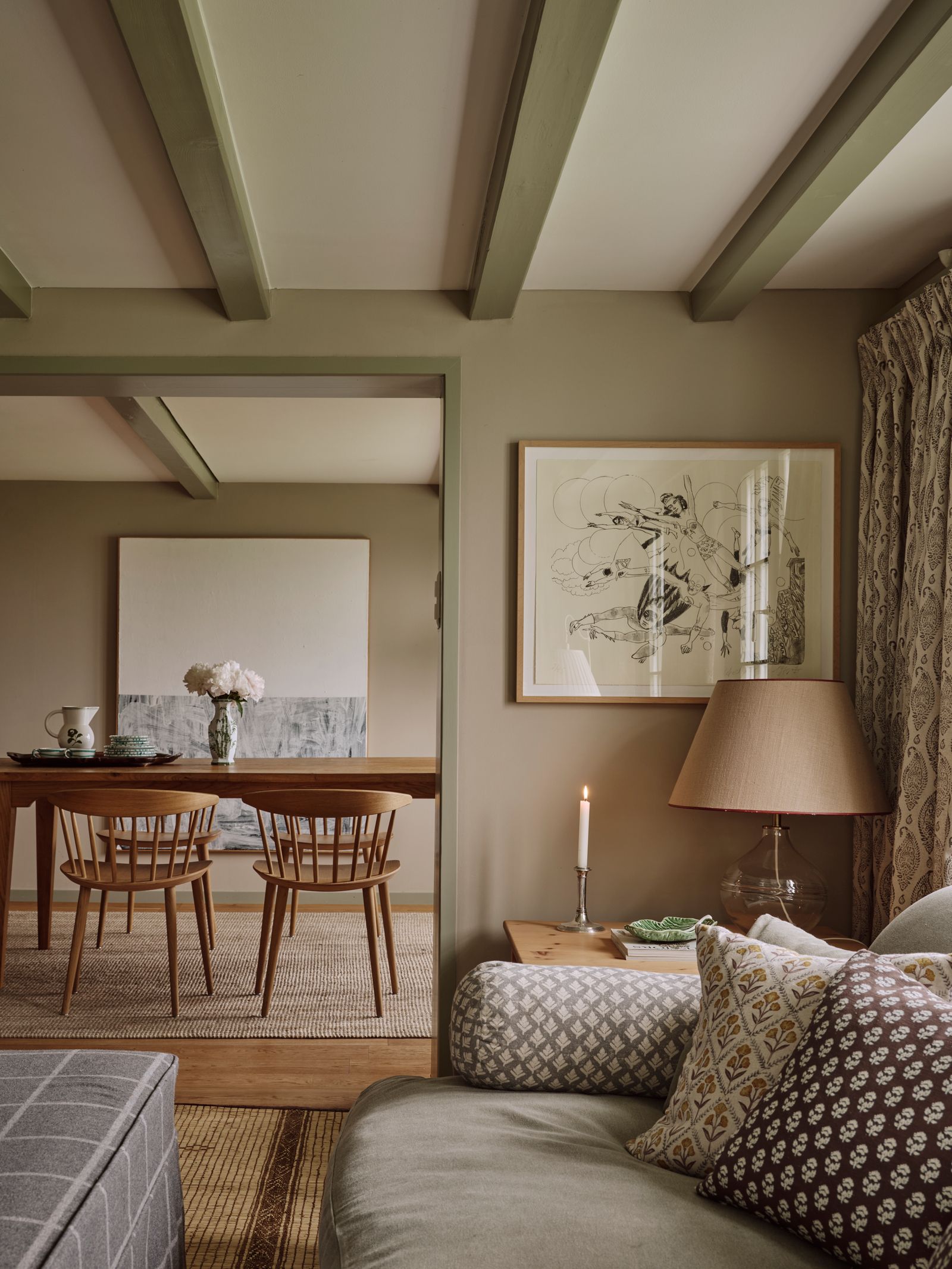 A view through to the dining room where Jørgen Baekmarks ‘J104 chairs from Hay stand on jute matting from Rugvista. The...