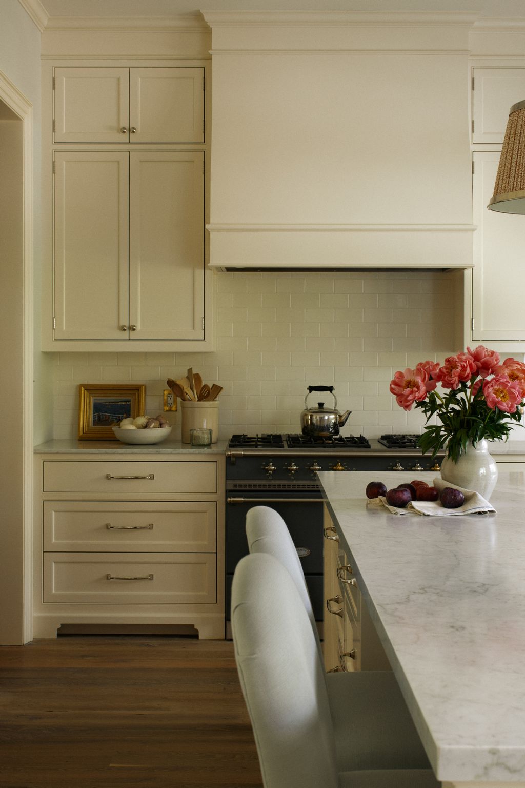A large marbletopped island and a Lacanche range help make this kitchen perfect for entertaining family and friends...