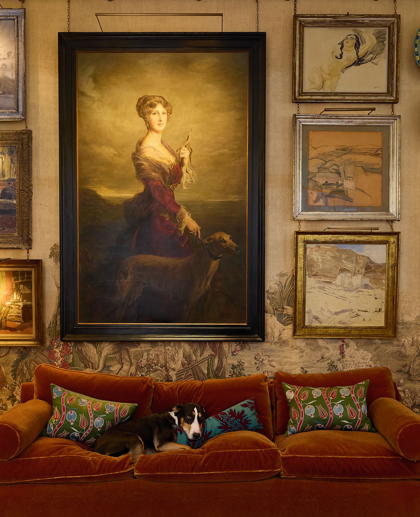 A copy of Philip de Lszlós 1913 portrait of Lady Londonderry and her lurcher Fly presides over a corner at Oswalds with...