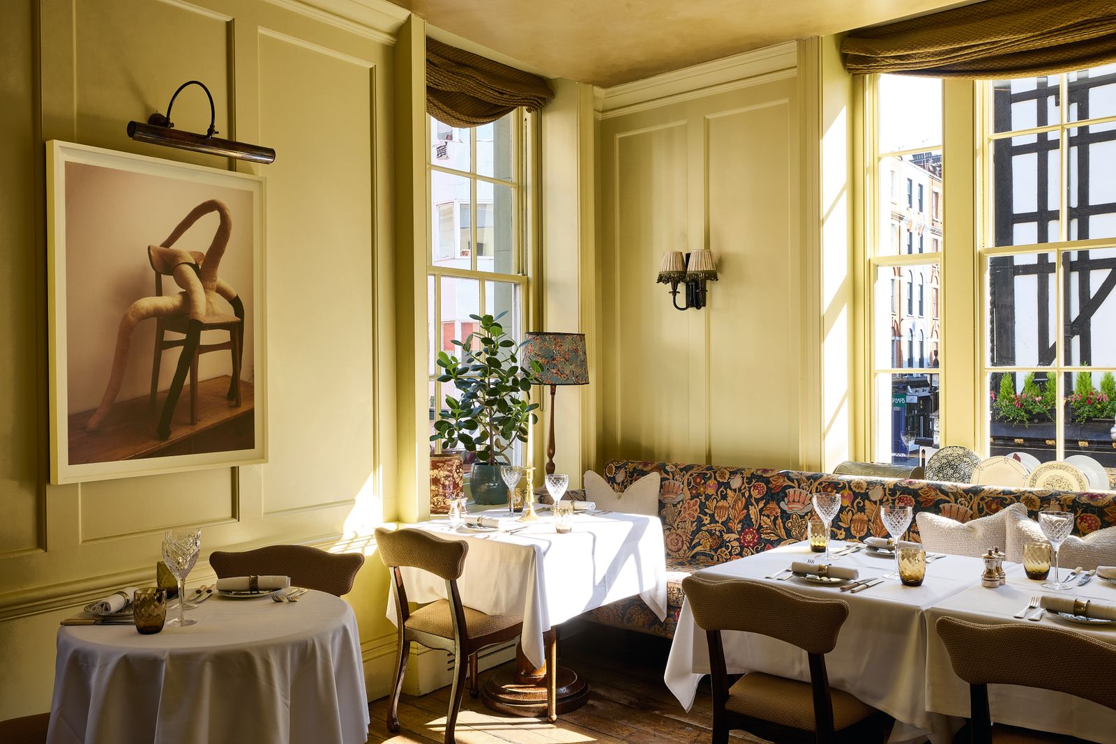 At 40 Greek Street the original Soho House the Yellow Dining Room features a picture by Sarah Lucas.