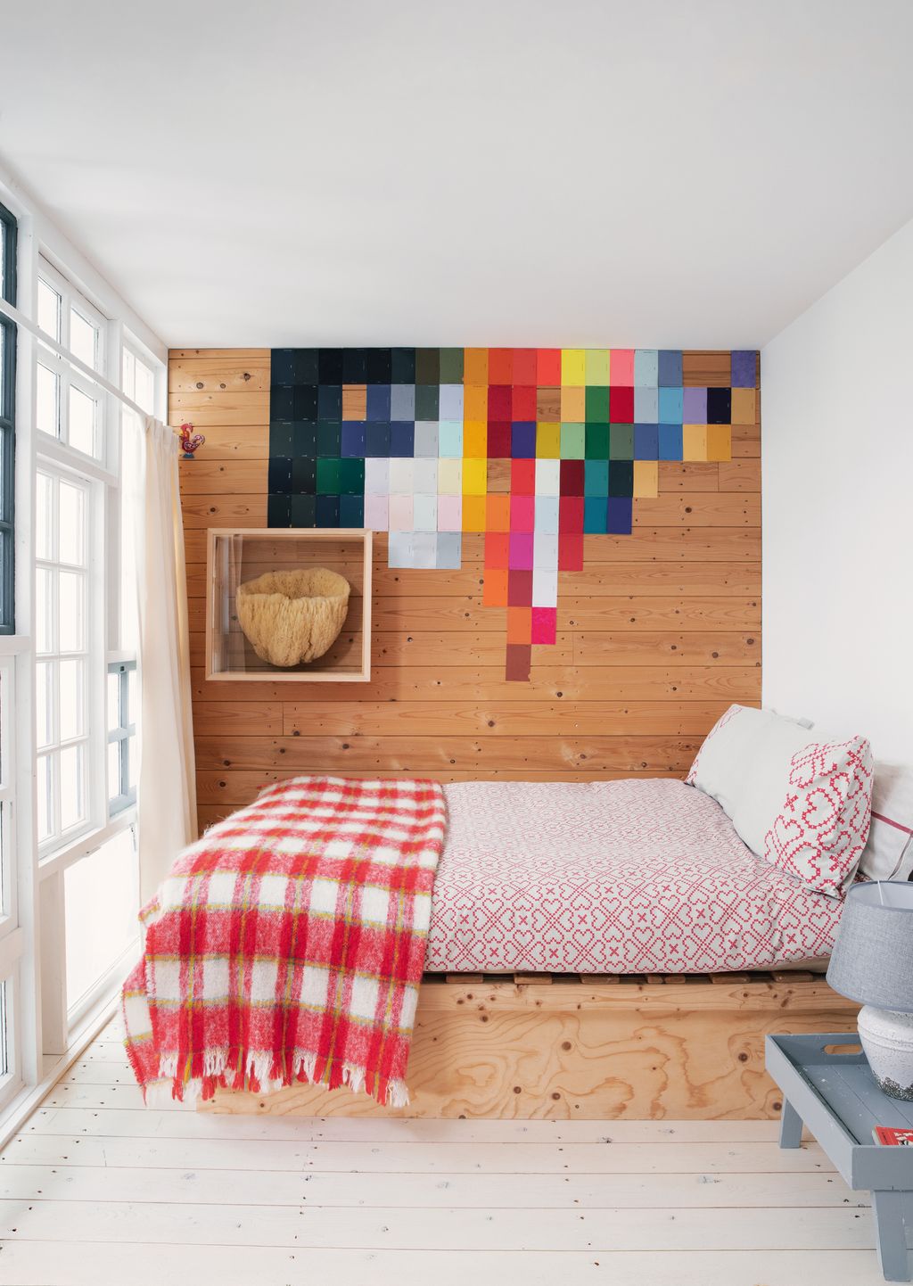 On the wall of Onis bedroom a framed artwork of a giant sponge from Hydra hangs next to a striking collage of Pantone...