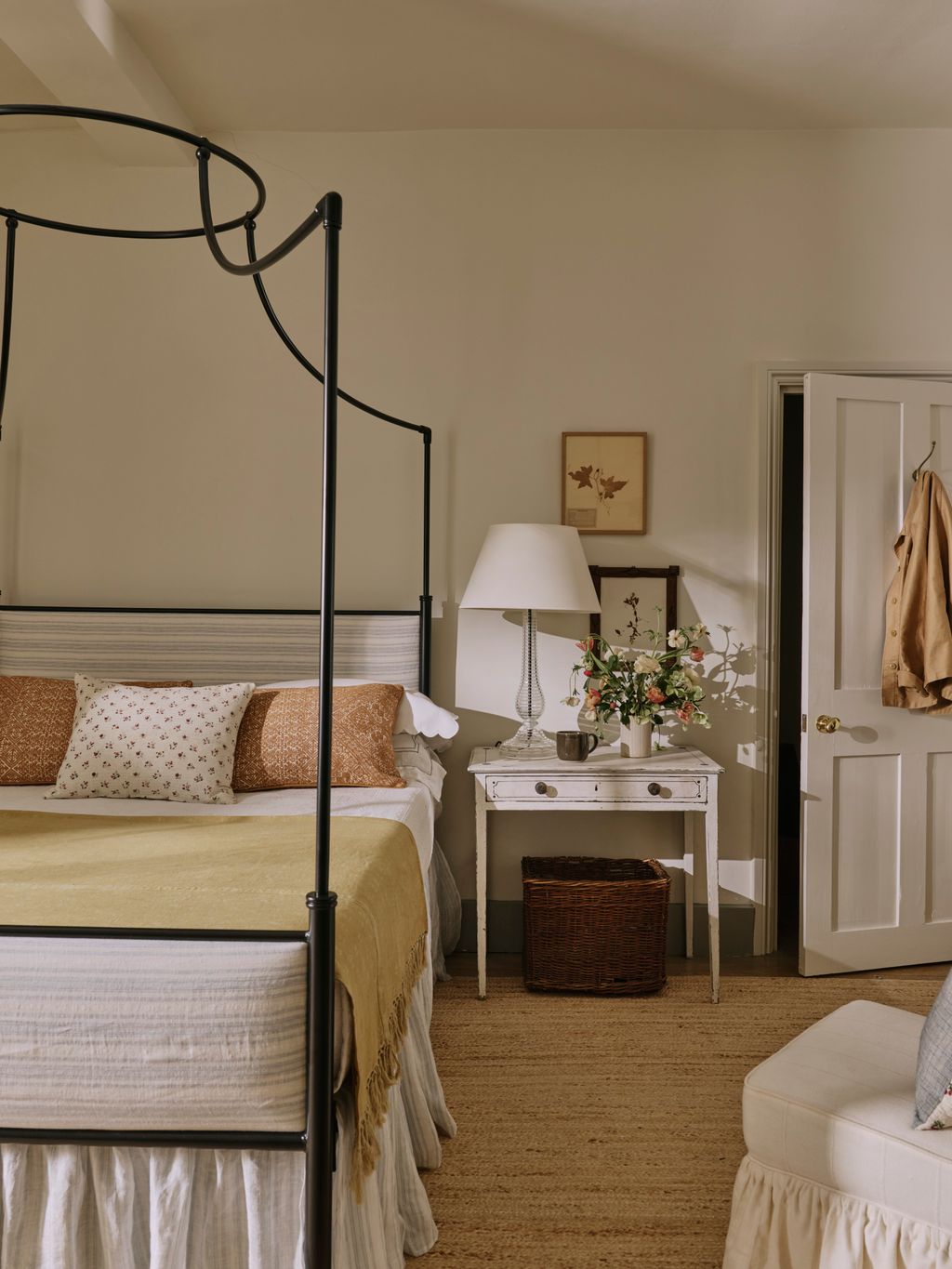 The fourposter is from the Original Bed Company and has been upholstered in Schumacher's ‘Motallegro Linen Stripe. The...