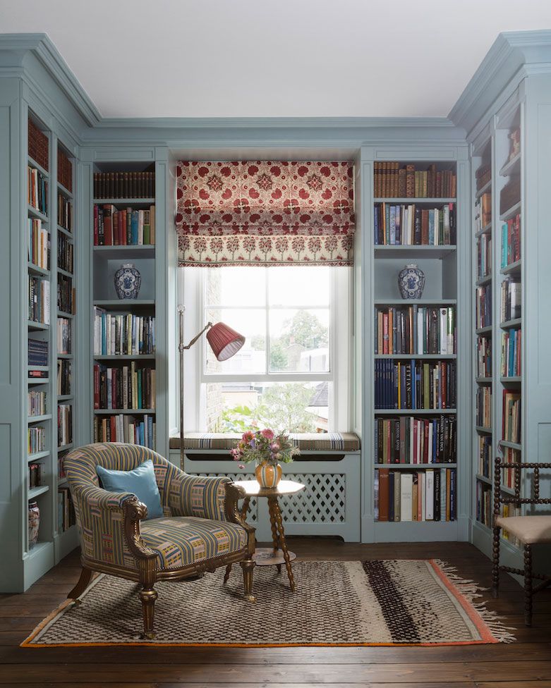 Kate Guinness and her team chose to paint this library in Ethereal Blue by Edward Bulmer and layered it with bolder red...