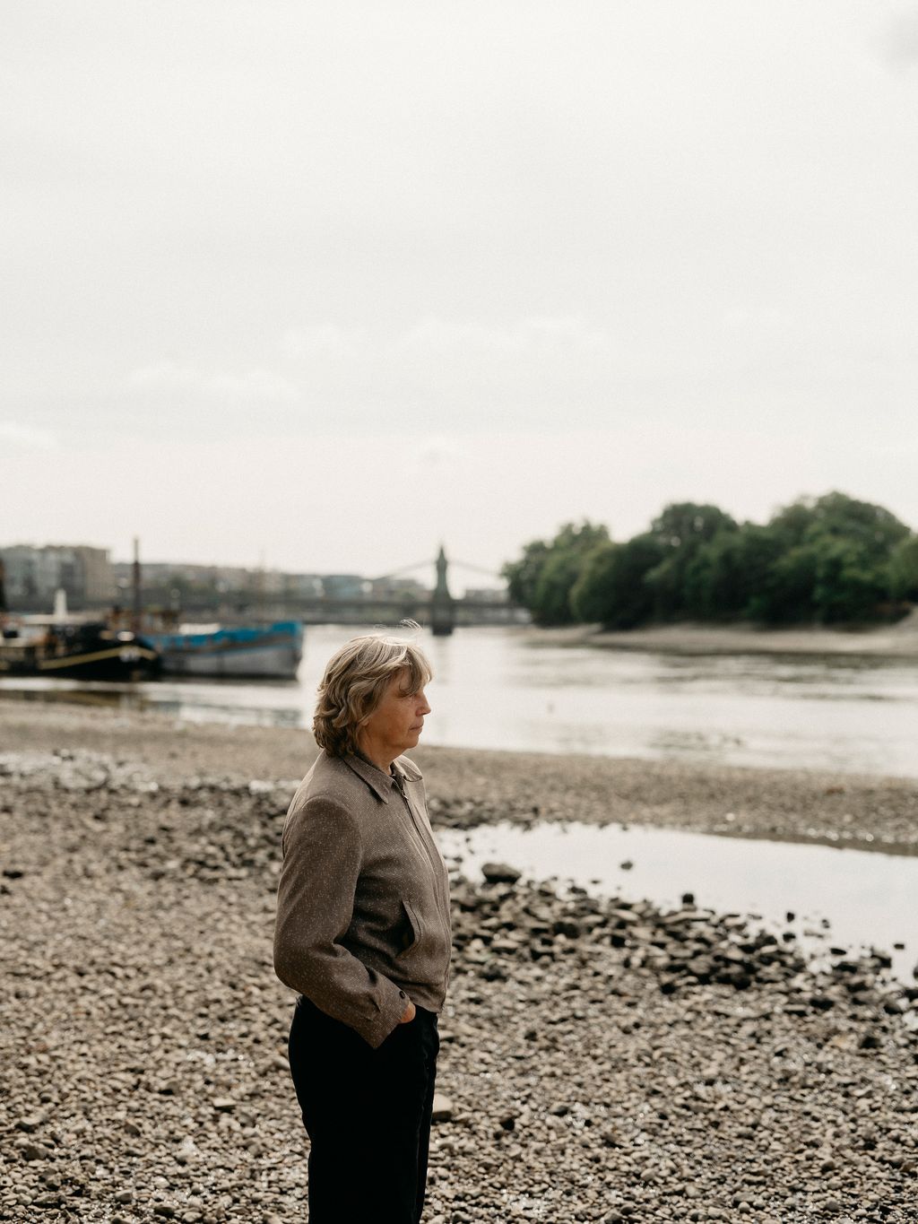 Tarka on the Thames beach by her studio at low tide.