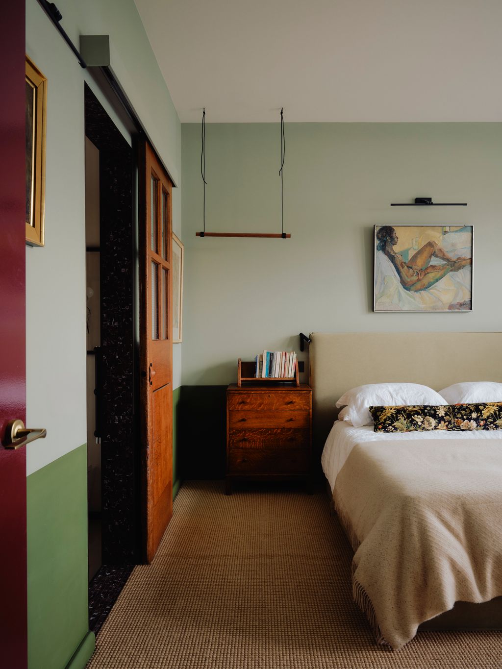In the main bedroom a Crucial Trading carpet grounds antique furniture inherited from Clares father. A cushion in House...