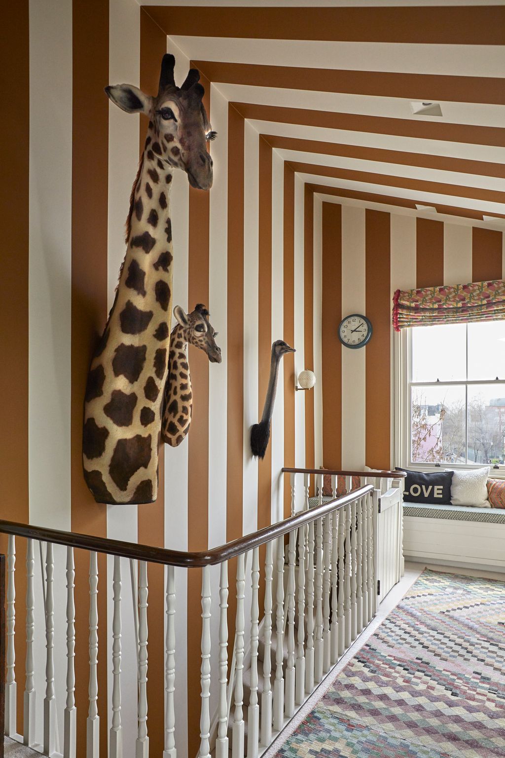On the topfloor landing outside the childrens bedrooms and bathroom giraffe and ostrich heads made by Welsh company...