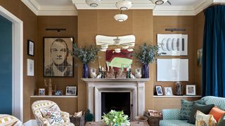 The sitting room on the upperground floor is furnished with a sofa from Lorfords covered in ‘Les Ecailles by Le Manach...