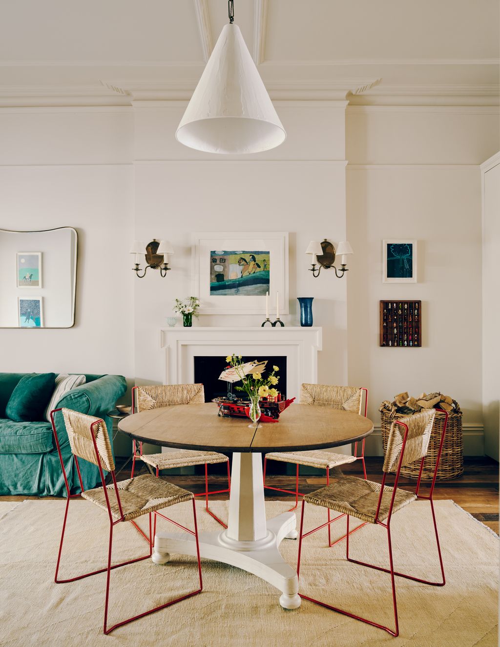Rose Uniacke's ‘plaster cone hanging light hangs above a table.